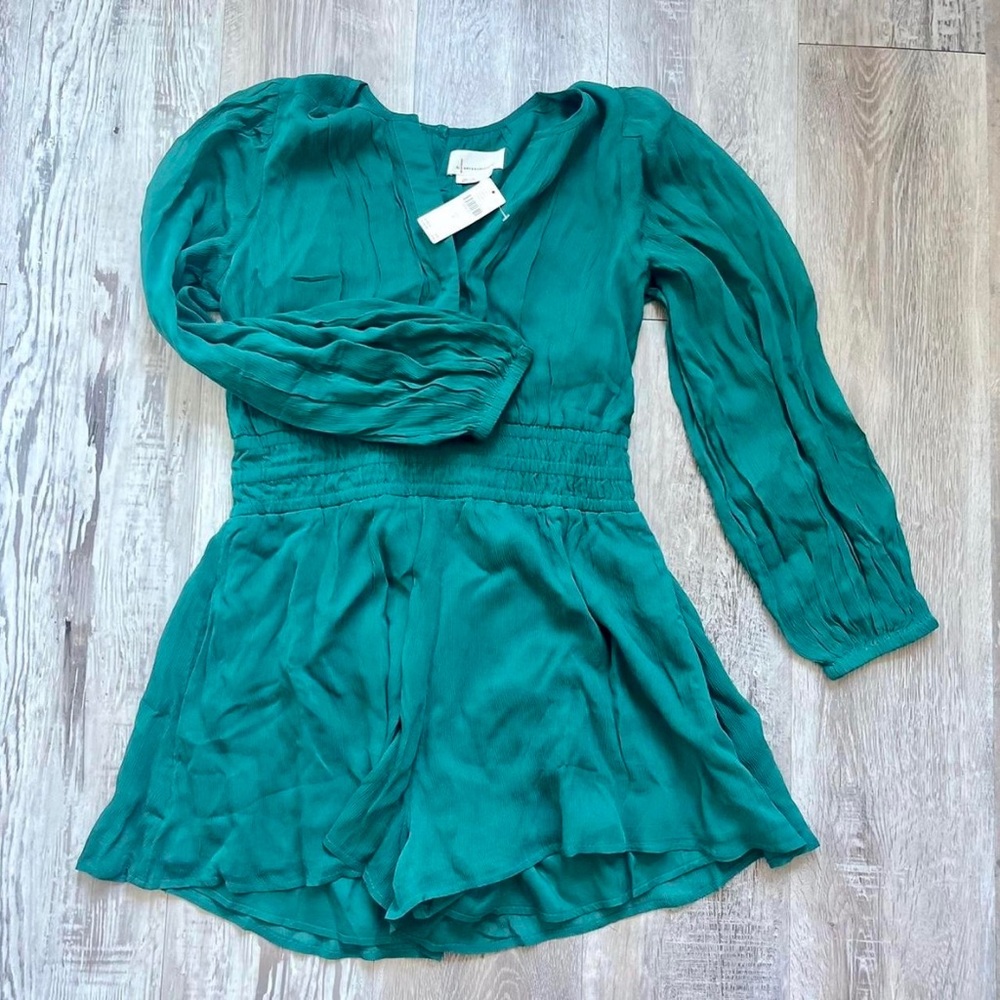 Beautiful flowy green romper by Anthropologie